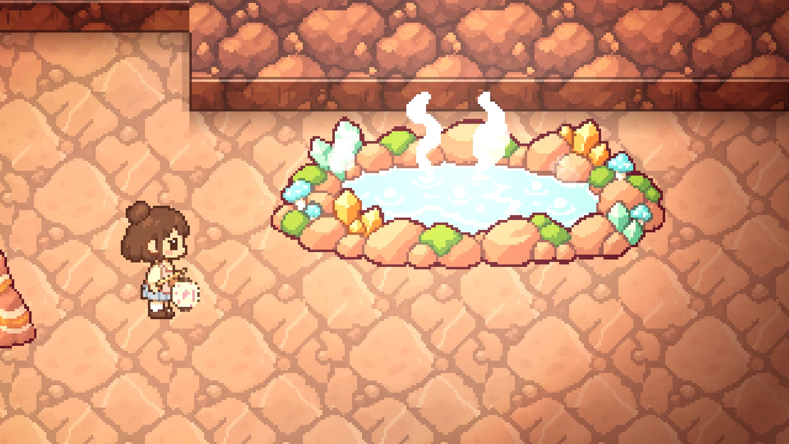 A steaming spring in a ring of warm stones and crystals, deep underground